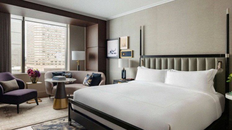 Contemporary king guest room with neutral palette at Raffles Boston